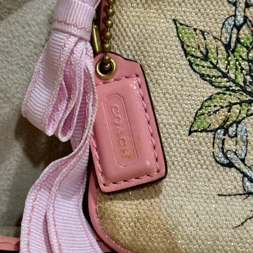 Limited Edition Coach Floral Canvas Wristlet Leather Trim and Bow
Charm - Picture 4 of 9